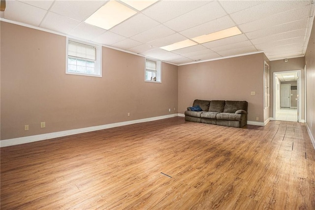 5247 Yeager Rd, Douglasville, GA 30135 - unfurnished living room featuring light wood finished floors, baseboards, and a drop ceiling