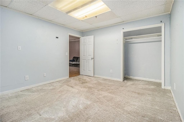 5247 Yeager Rd, Douglasville, GA 30135 - unfurnished bedroom with a drop ceiling, carpet floors, a closet, and baseboards