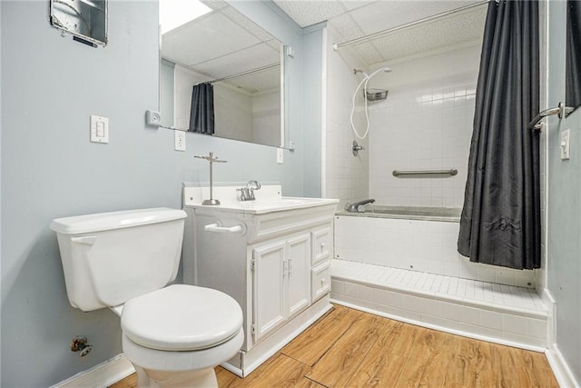 5247 Yeager Rd, Douglasville, GA 30135 - bathroom with vanity, toilet, tiled shower / bath, wood finished floors, and baseboards