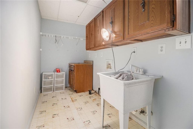 5247 Yeager Rd, Douglasville, GA 30135 - laundry area with light flooring, hookup for a washing machine, baseboards, and a sink
