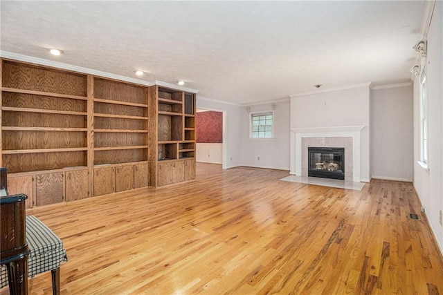 5247 Yeager Rd, Douglasville, GA 30135 - unfurnished living room featuring ornamental molding, wood finished floors, a tiled fireplace, baseboards, and recessed lighting