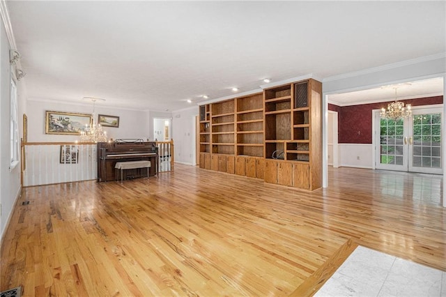5247 Yeager Rd, Douglasville, GA 30135 - unfurnished living room with a chandelier, crown molding, wood finished floors, wainscoting, and recessed lighting