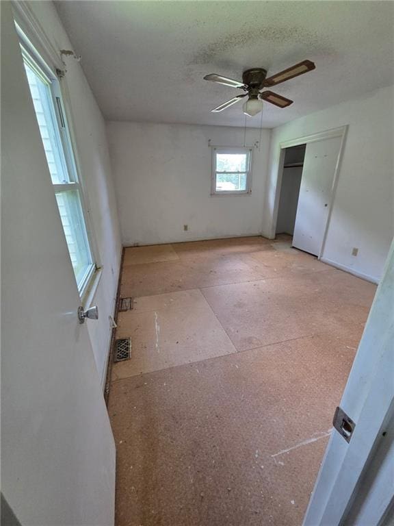 3400 Elm Creek Dr NW, Marietta, GA 30064 - unfurnished bedroom with a ceiling fan, a closet, and a textured ceiling