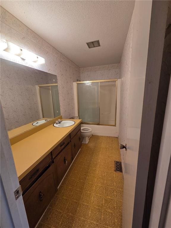 3400 Elm Creek Dr NW, Marietta, GA 30064 - bathroom featuring a textured ceiling, vanity, shower / bath combination with glass door, and tile patterned floors