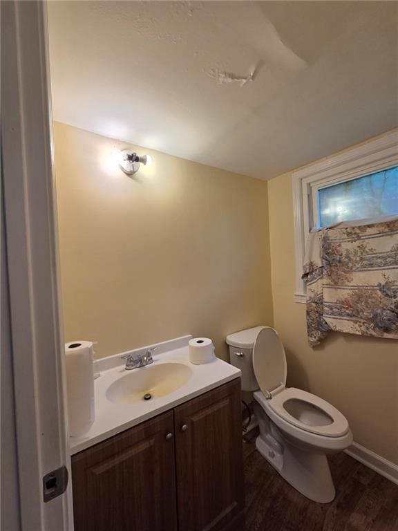 3400 Elm Creek Dr NW, Marietta, GA 30064 - half bathroom featuring vanity and wood finished floors