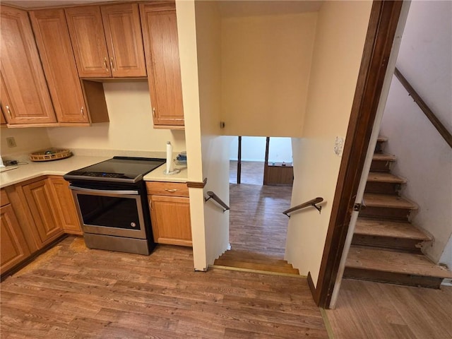 3400 Elm Creek Dr NW, Marietta, GA 30064 - kitchen with stainless steel electric range, light wood-type flooring, and light countertops
