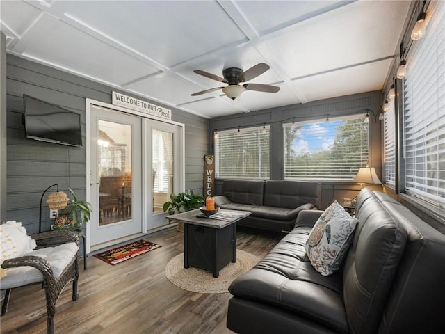 sunroom with ceiling fan and coffered ceiling