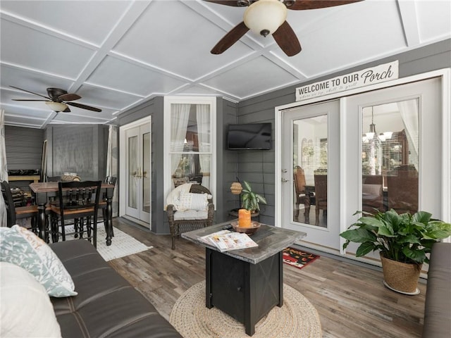 sunroom / solarium with coffered ceiling and ceiling fan