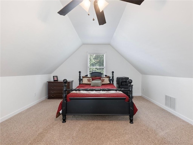 carpeted bedroom with ceiling fan and lofted ceiling