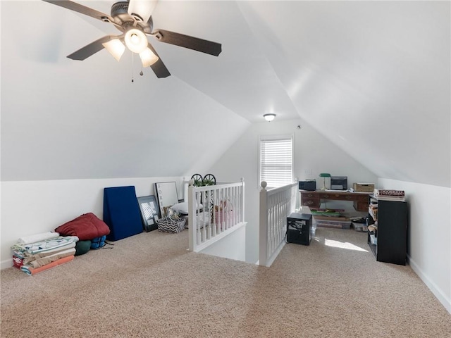 interior space with carpet, lofted ceiling, and ceiling fan