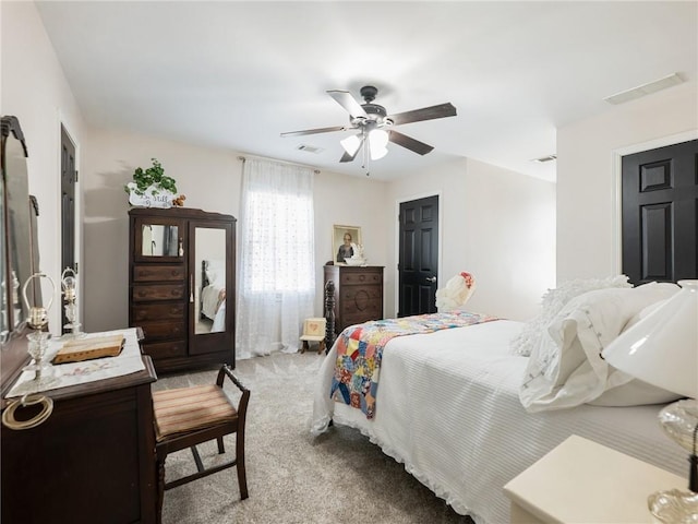 carpeted bedroom with ceiling fan