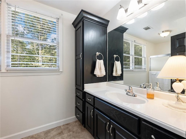 bathroom with vanity and tile patterned flooring