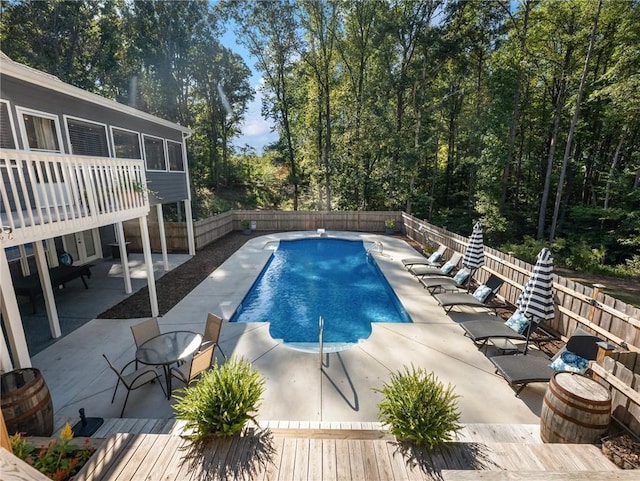 view of swimming pool with a patio