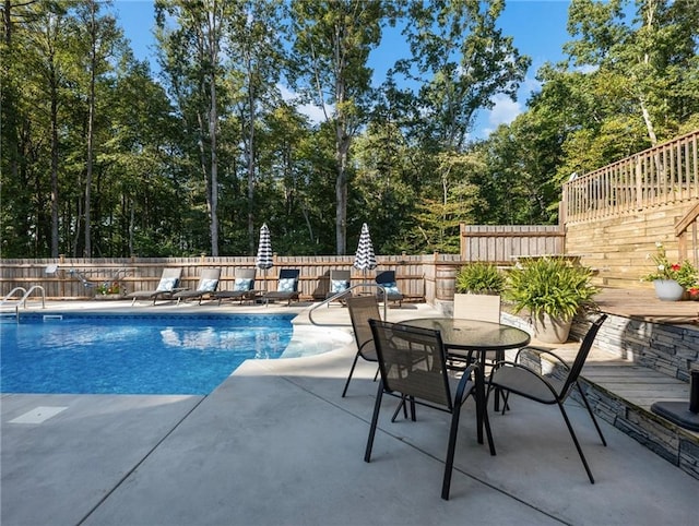 view of pool featuring a patio