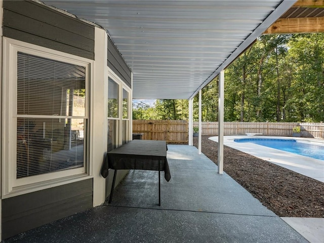 view of patio / terrace with a fenced in pool