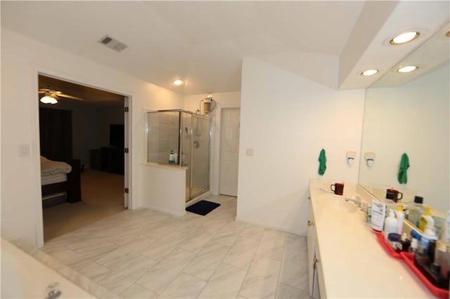 bathroom with ceiling fan, vanity, and a shower with shower door