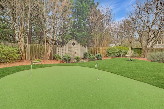 view of home's community with a fenced backyard