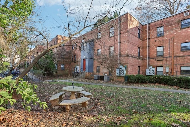 view of building exterior with central AC unit