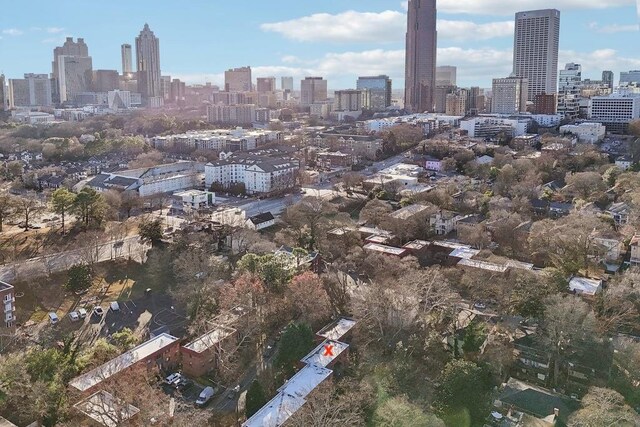 birds eye view of property with a view of city