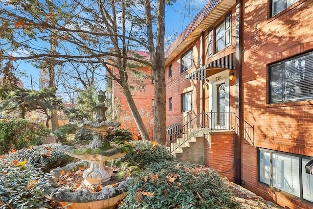 view of property exterior featuring brick siding