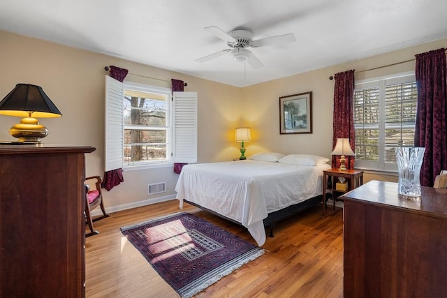 bedroom featuring light hardwood / wood-style floors and ceiling fan