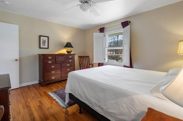 bedroom with ceiling fan and light wood-type flooring