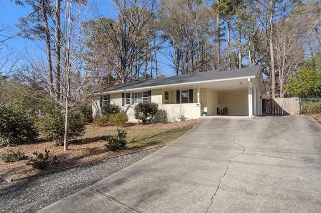 ranch-style home with a carport