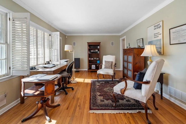 office area featuring crown molding and light hardwood / wood-style flooring