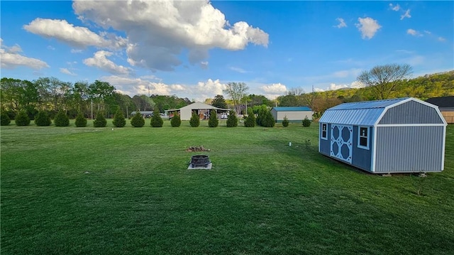 view of yard featuring a shed and an outbuilding