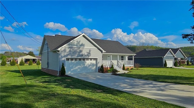view of front of home with a garage, a front yard, a porch, and concrete driveway