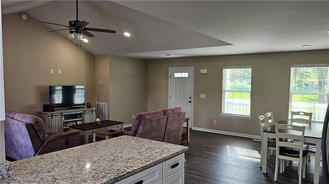 living room featuring dark wood-style flooring, baseboards, recessed lighting, lofted ceiling, and ceiling fan