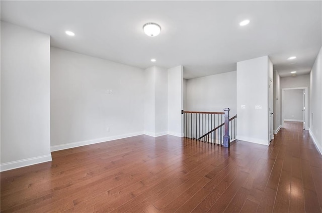 spare room with dark hardwood / wood-style floors