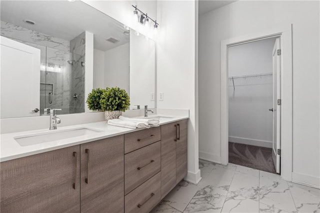 bathroom featuring vanity and a shower with shower door