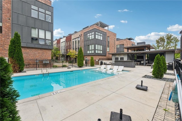 view of swimming pool featuring a patio area