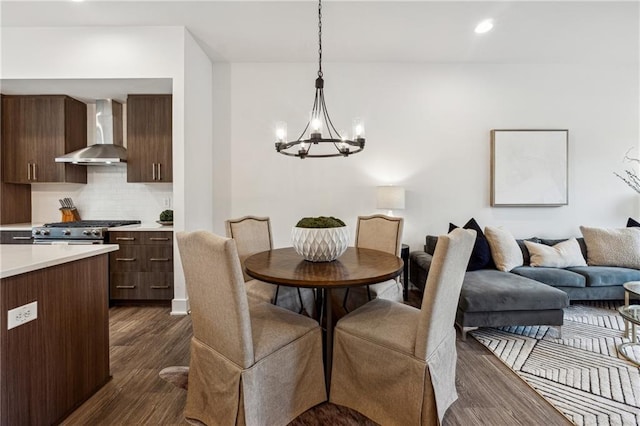 dining room featuring a notable chandelier and dark wood-type flooring