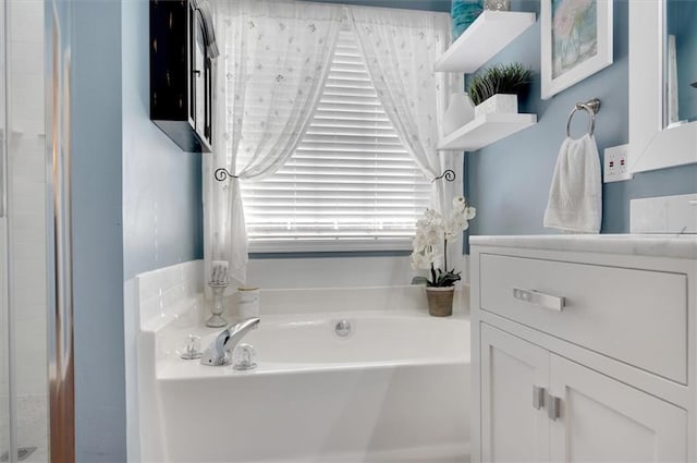 bathroom with vanity and a bathing tub