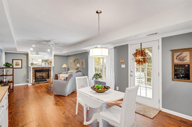 dining room featuring ceiling fan, light hardwood / wood-style floors, and ornamental molding