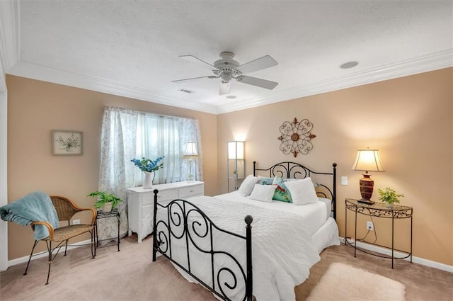 carpeted bedroom with ceiling fan and crown molding