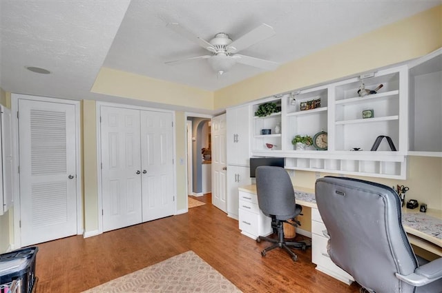 office area featuring hardwood / wood-style flooring, ceiling fan, and a textured ceiling