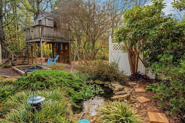 view of yard with a wooden deck