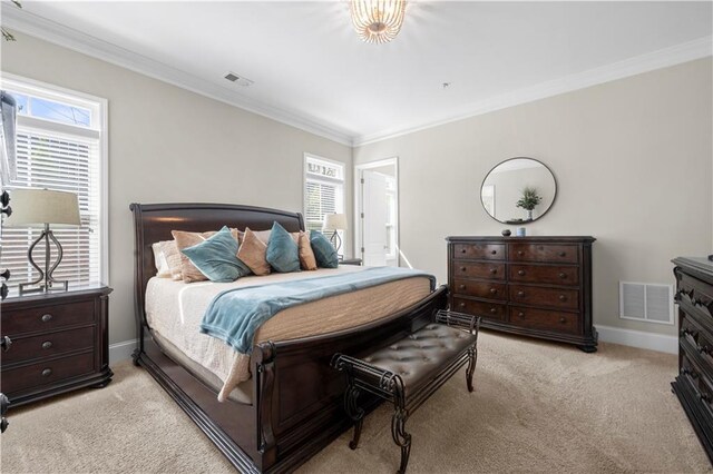 bedroom with light carpet, multiple windows, and visible vents
