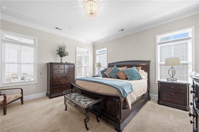 bedroom with ornamental molding, light carpet, baseboards, and visible vents