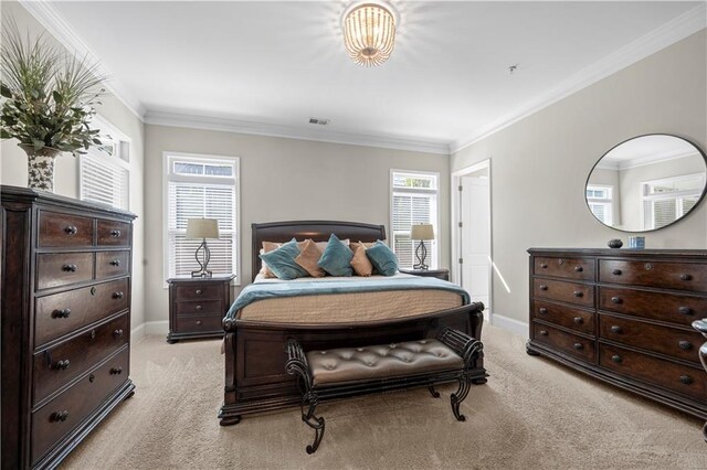 bedroom with light carpet, crown molding, and baseboards