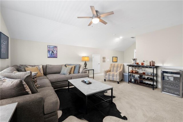 carpeted living area with lofted ceiling and ceiling fan