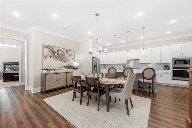 dining space with ornamental molding, an inviting chandelier, recessed lighting, and dark wood finished floors