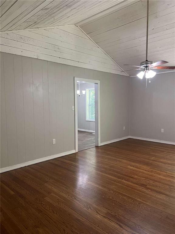 unfurnished room with wood ceiling, wooden walls, vaulted ceiling, dark hardwood / wood-style flooring, and ceiling fan