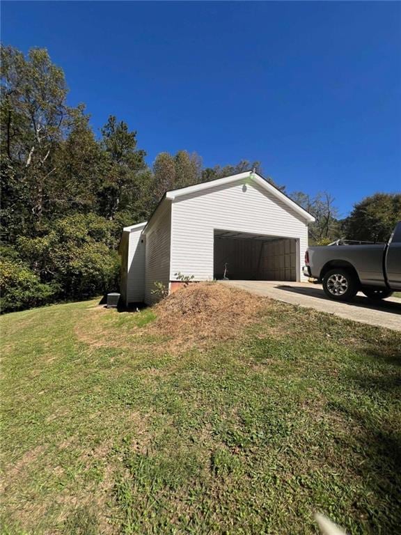 garage with a yard