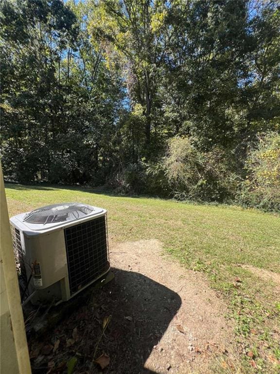 view of yard with central AC unit