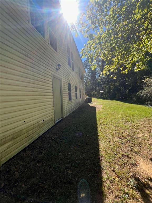 view of home's exterior featuring a lawn