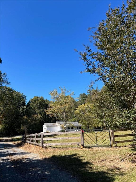 view of gate featuring fence